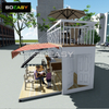 Zweist&ouml;ckiges Caf&eacute; mit erweiterbarem Containerhaus im Balkondesign